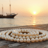 Traditional Bahraini pearl diving heritage displayed alongside lustrous natural pearl necklace jewelry