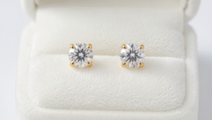Elegant diamond stud earrings for women displayed on a white velvet jewelry stand in Bahrain