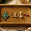 Statement earrings for Eid displayed on a gold velvet tray with Bahraini pearl and chandelier designs