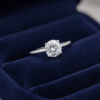 Traditional Bahraini ring with filigree gold work beside a modern diamond solitaire ring on a velvet tray